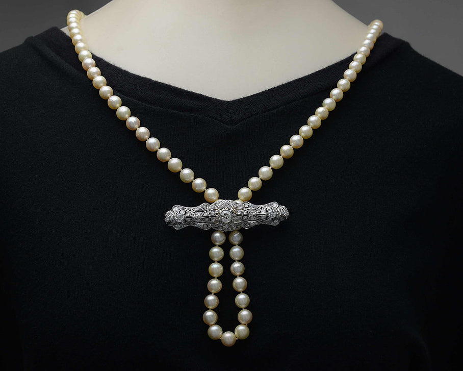 Here is an example on how to string a pearl strand through this diamond brooch.