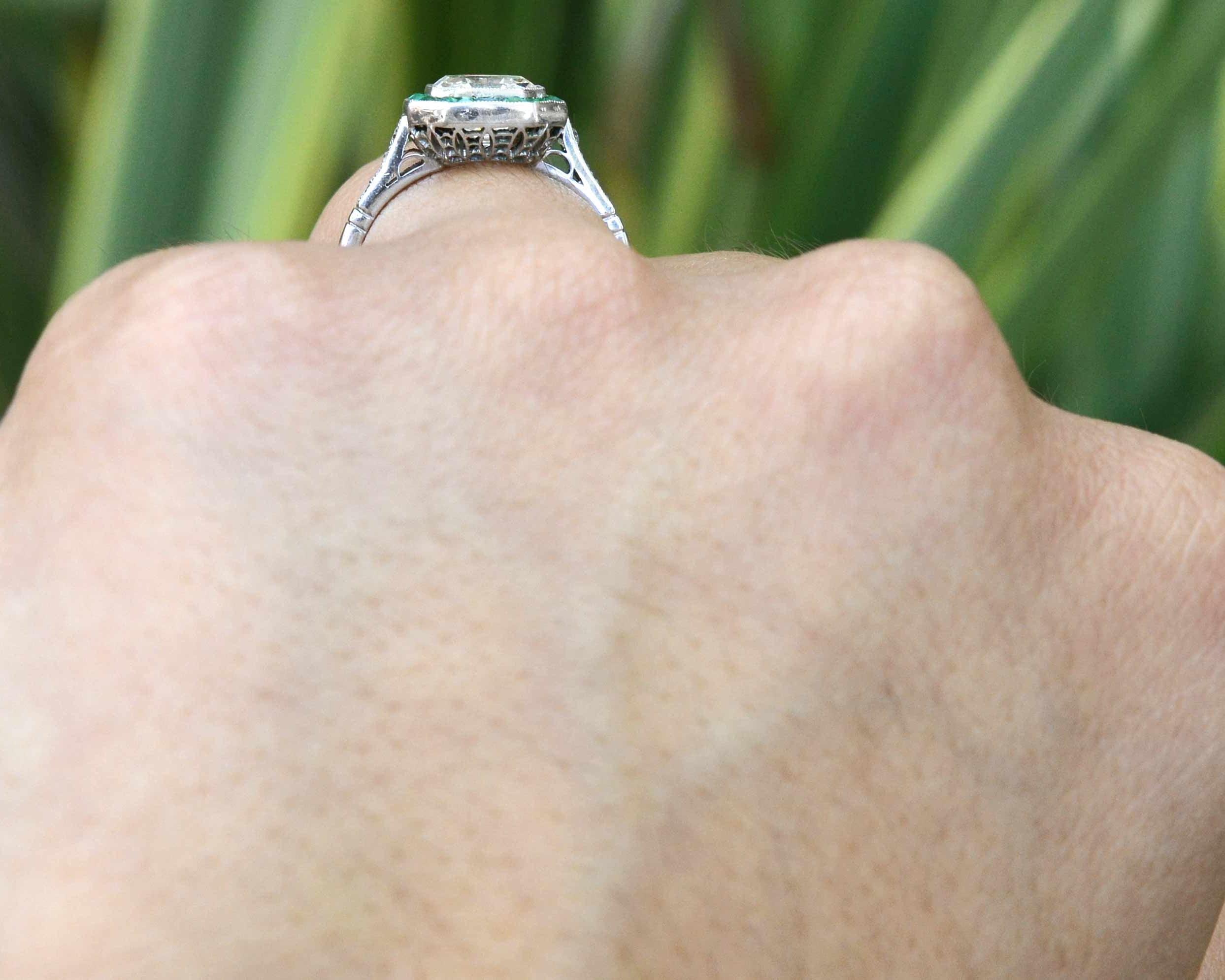 This diamond emerald ring sits low to your finger.