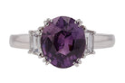 Three carat oval purple sapphire diamond 3 stone engagement ring.