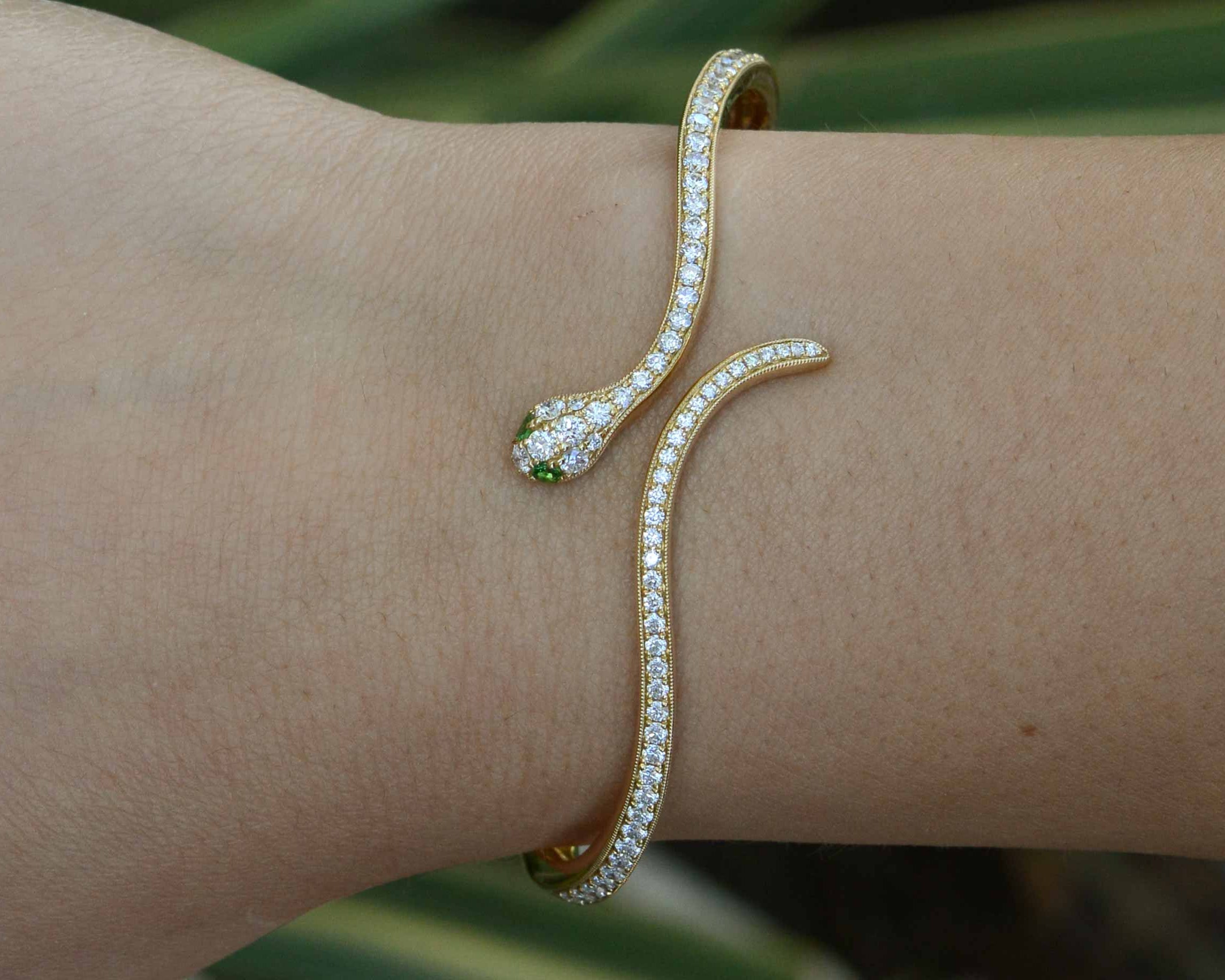Nearly 1 and a half carats of round diamonds line this thin modern snake bracelet.