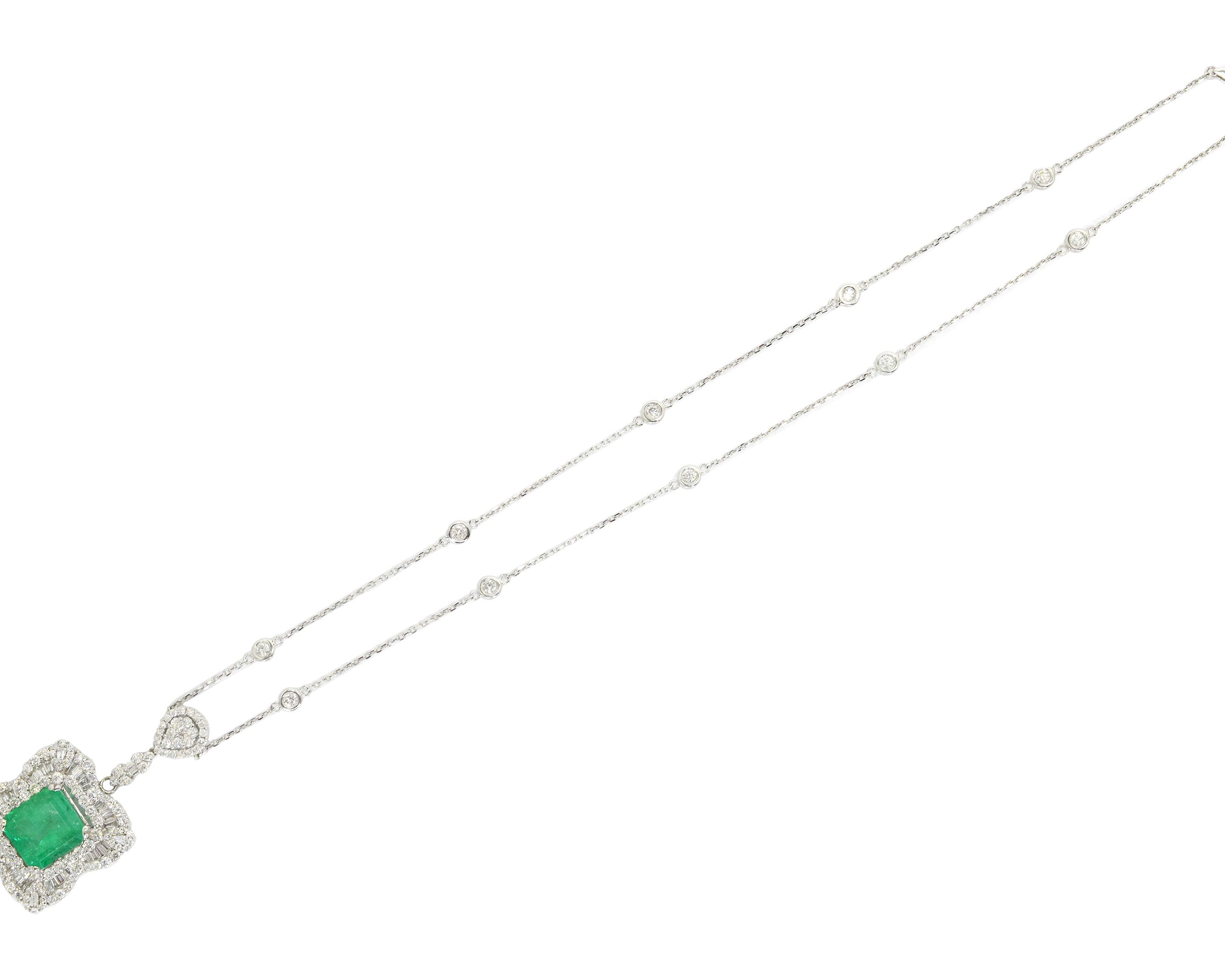 The pendant of 18kt white gold is suspended by a 14kt white gold diamonds by the yard chain measuring 18" long.