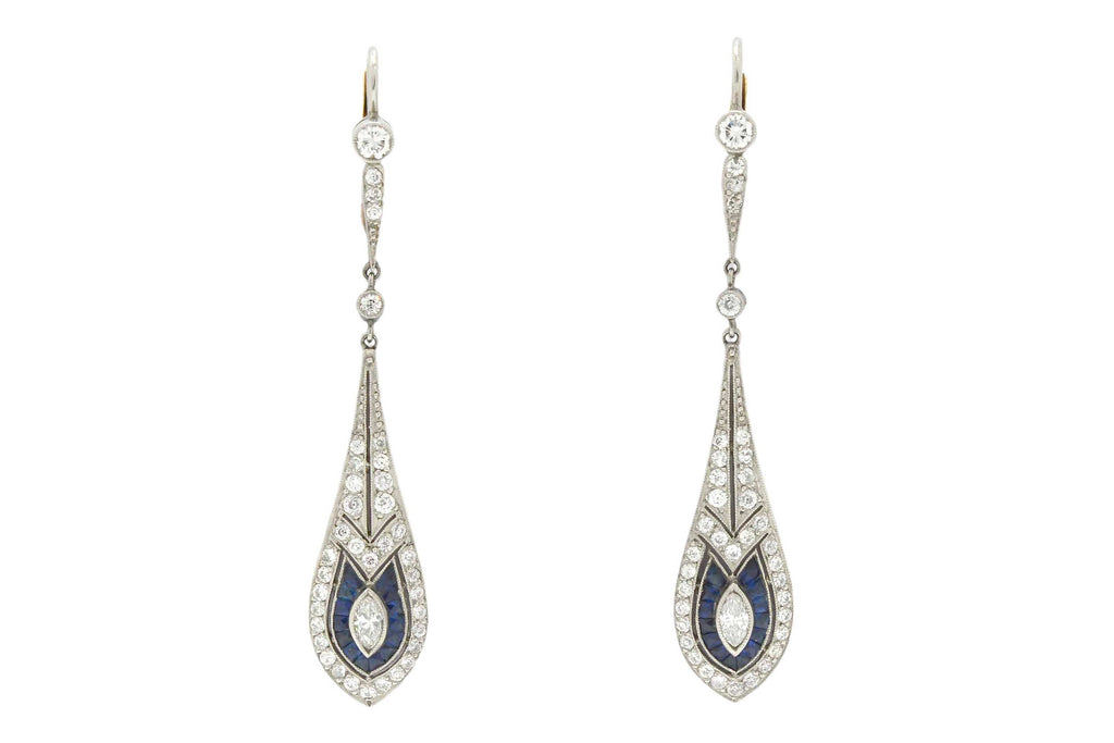 Diamond and blue sapphire dangle earrings created in the Art Deco style.