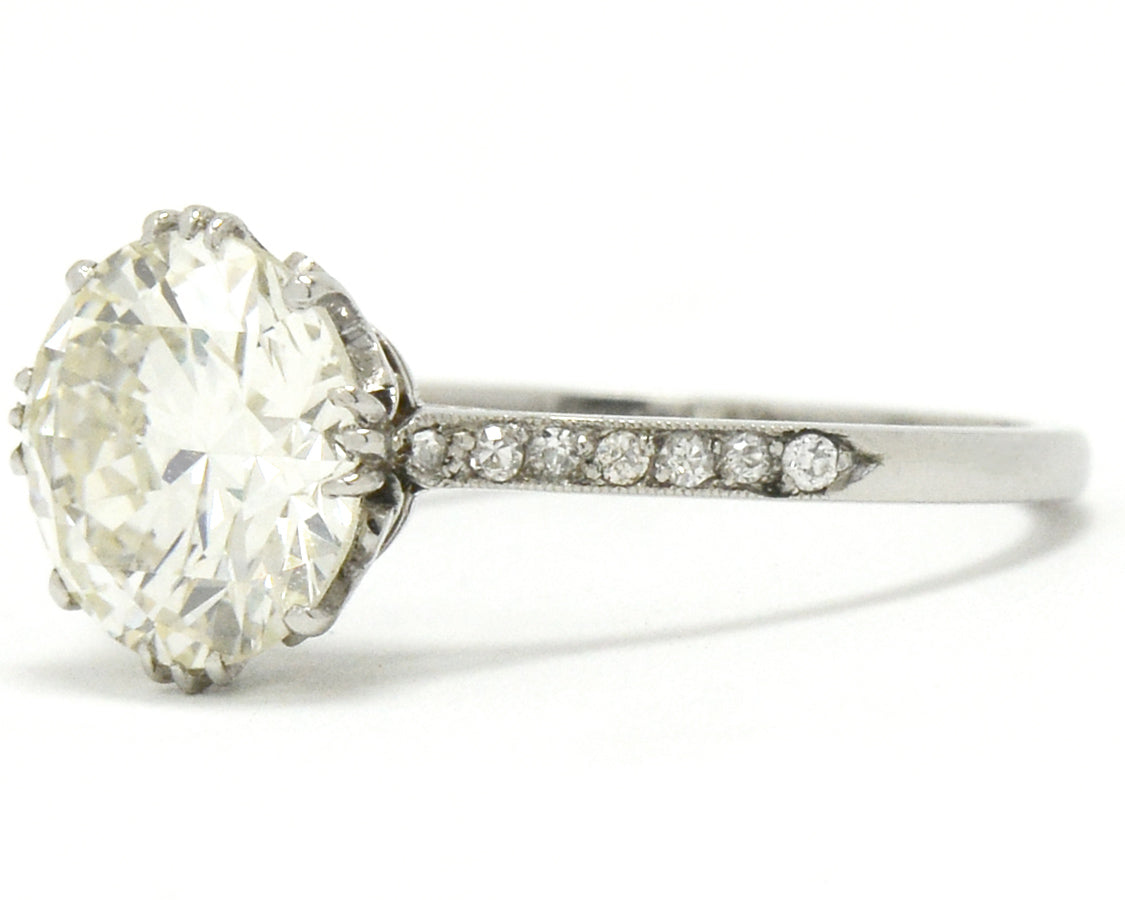 Edwardian style diamond solitaire ring secured by 4 prongs.