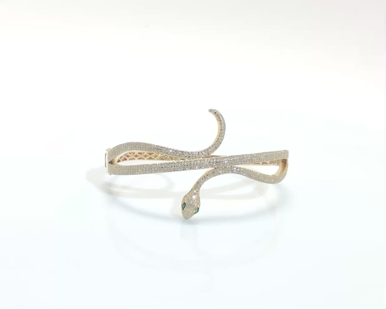 A yellow gold contemporary snake bracelet with over a carat of diamonds.