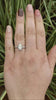 A 100 year old, platinum 3 stone diamond engagement ring.