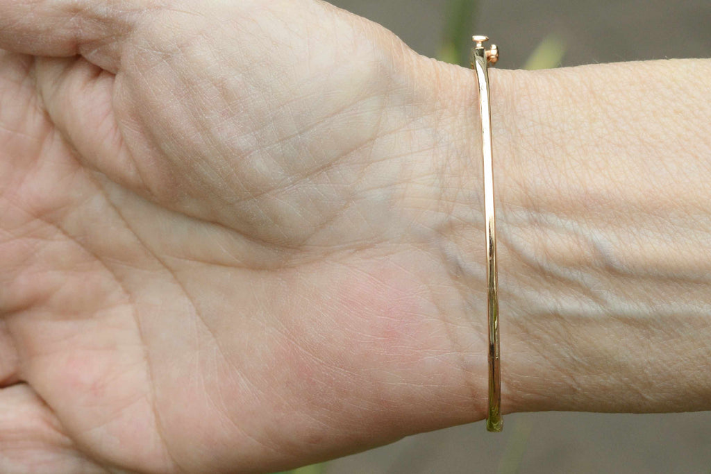 This thin bangle cuff bracelet fits a 7 inch wrist.