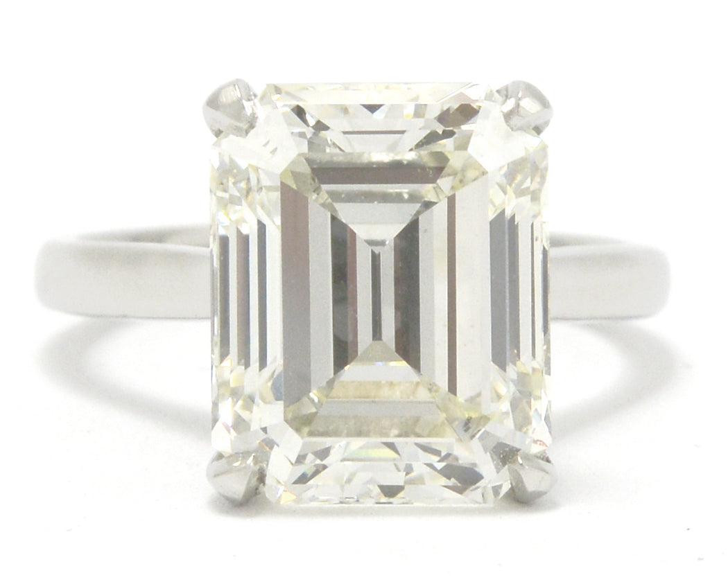 A large 8 carat emerald cut diamond solitaire engagement ring.