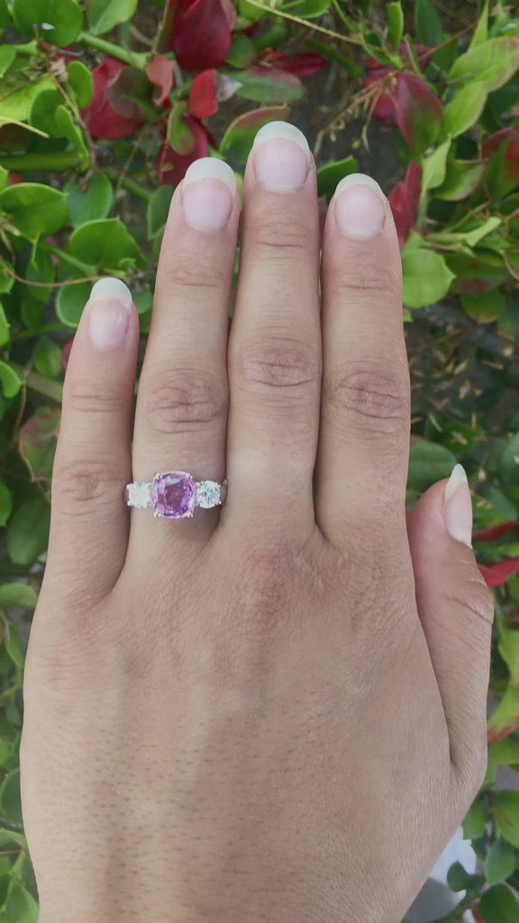 A 3 carat pink sapphire and 2 diamonds, natural gems engagement ring.