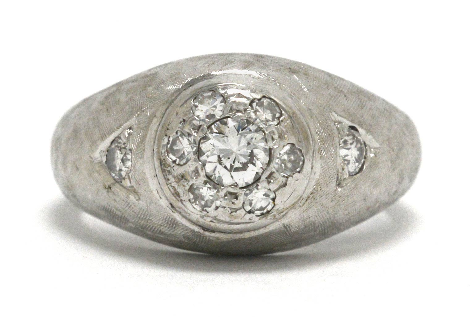 A transitional round brilliant diamond, white gold gypsy ring for men.