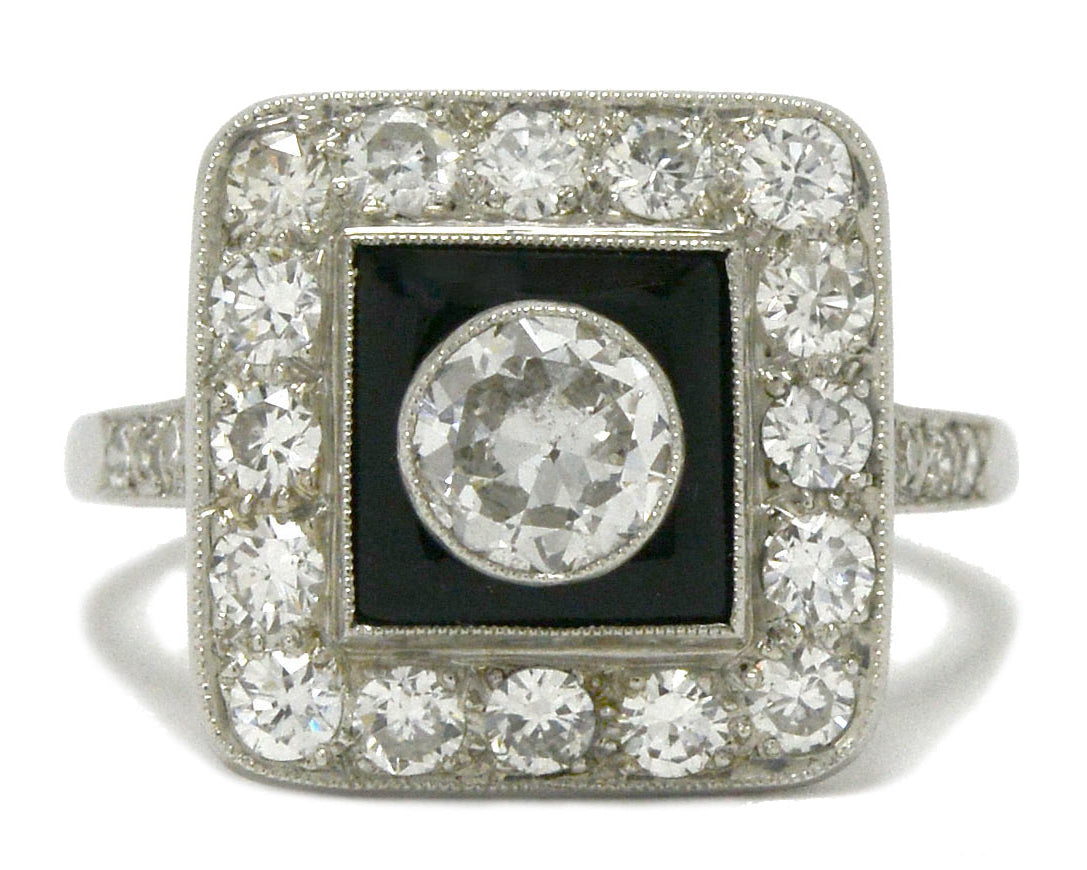 A diamond engagement ring with onyx created in an Art Deco style.
