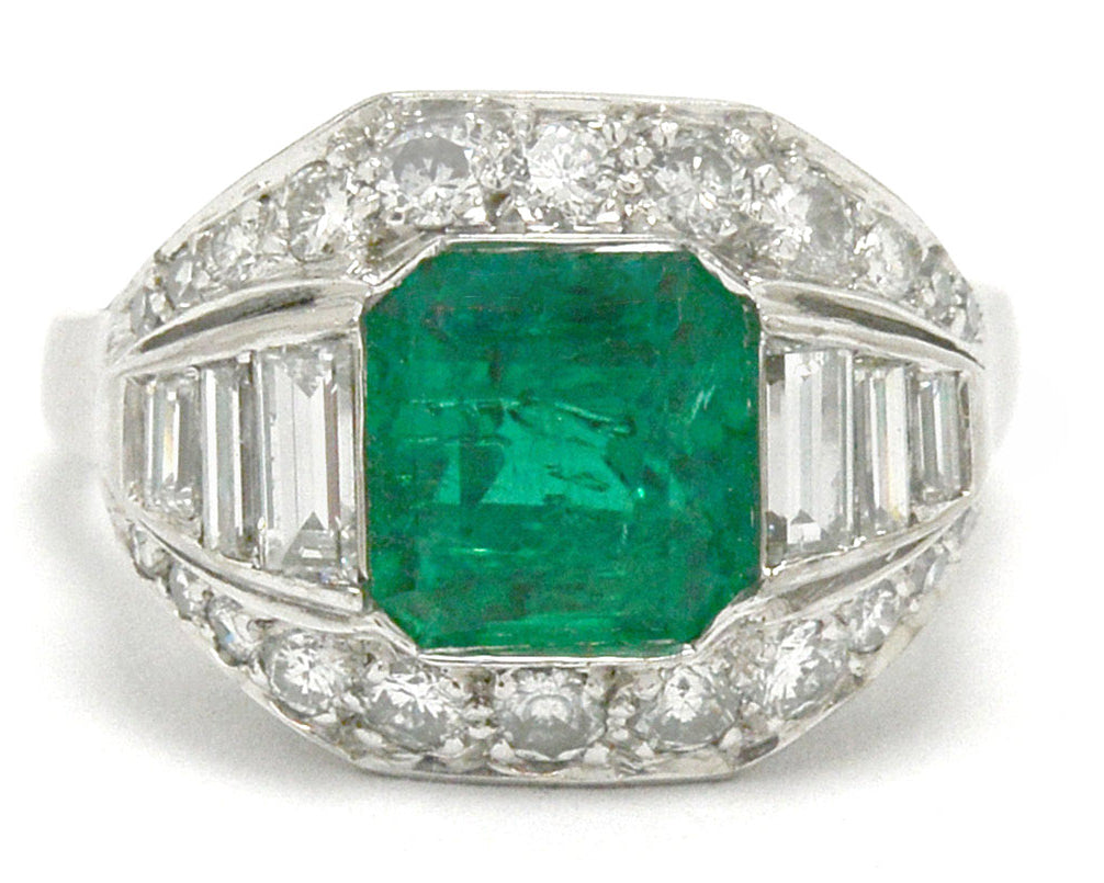 An Art Deco emerald and diamonds palladium engagement ring.