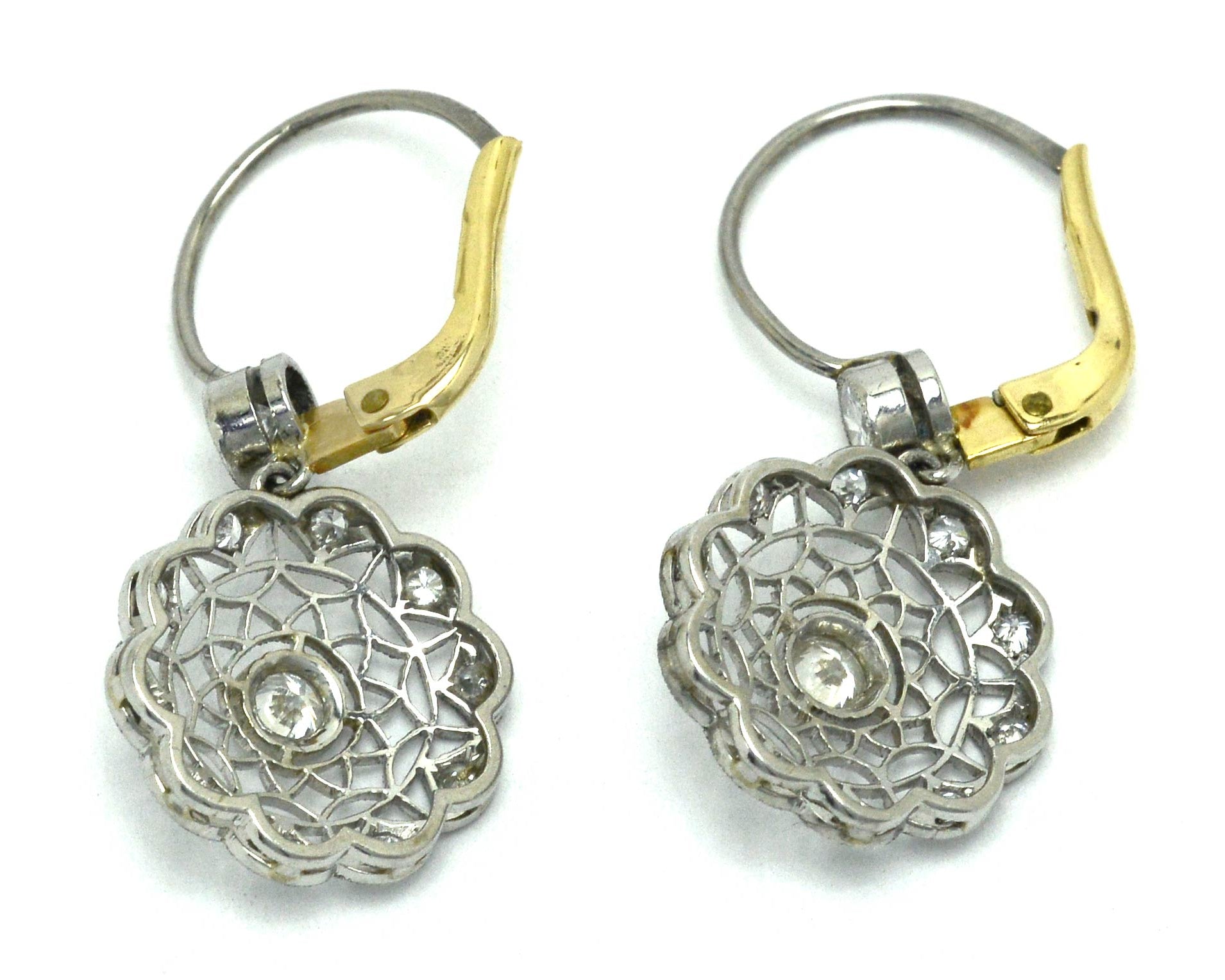 Platinum and yellow gold lever back, Edwardian diamond cluster earrings.