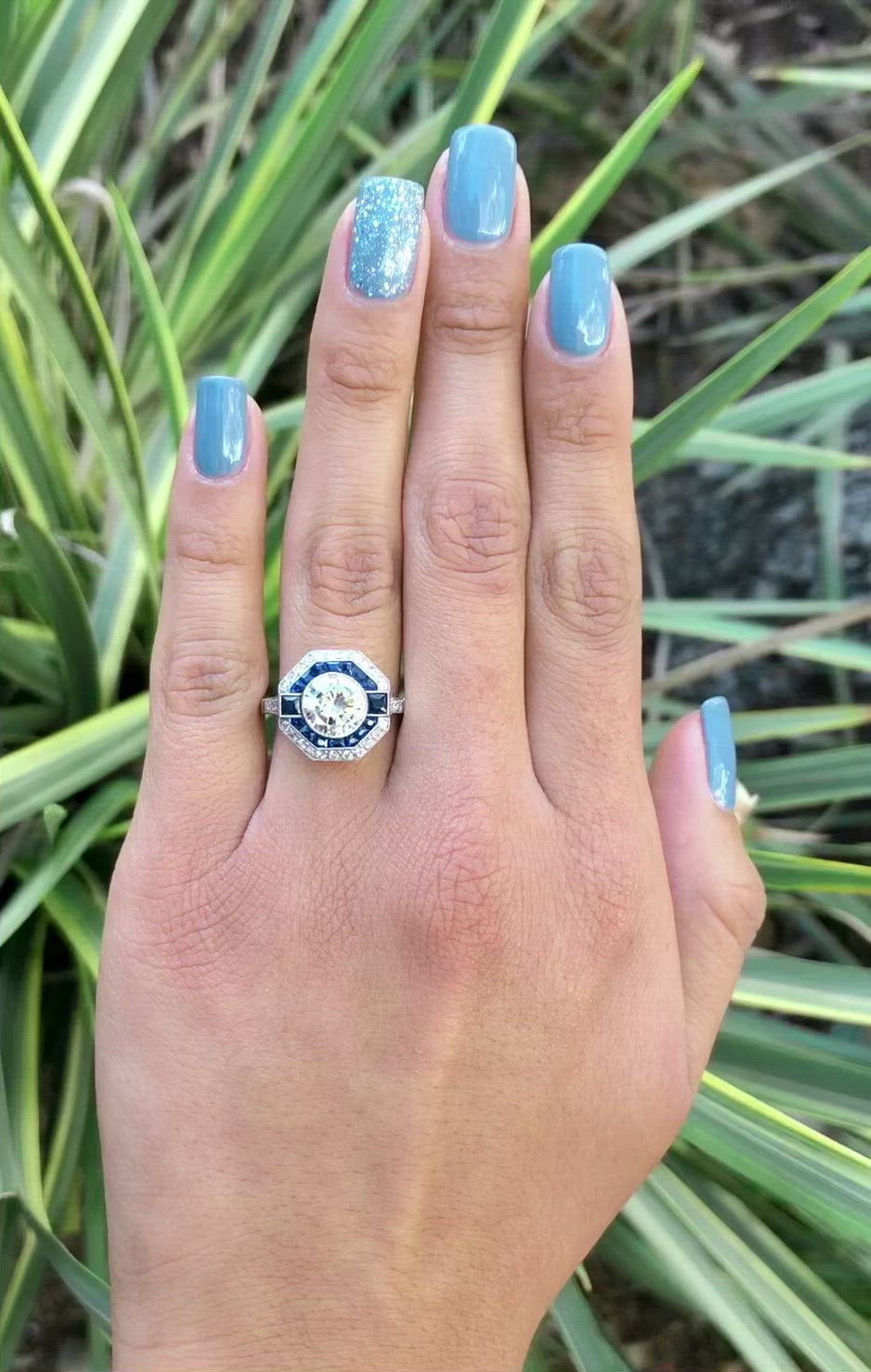 A stunning, large 2 carat diamond set in a blue sapphire octagon engagement ring.