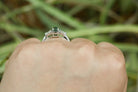 A two carat alexandrite, three stone diamond engagement ring.