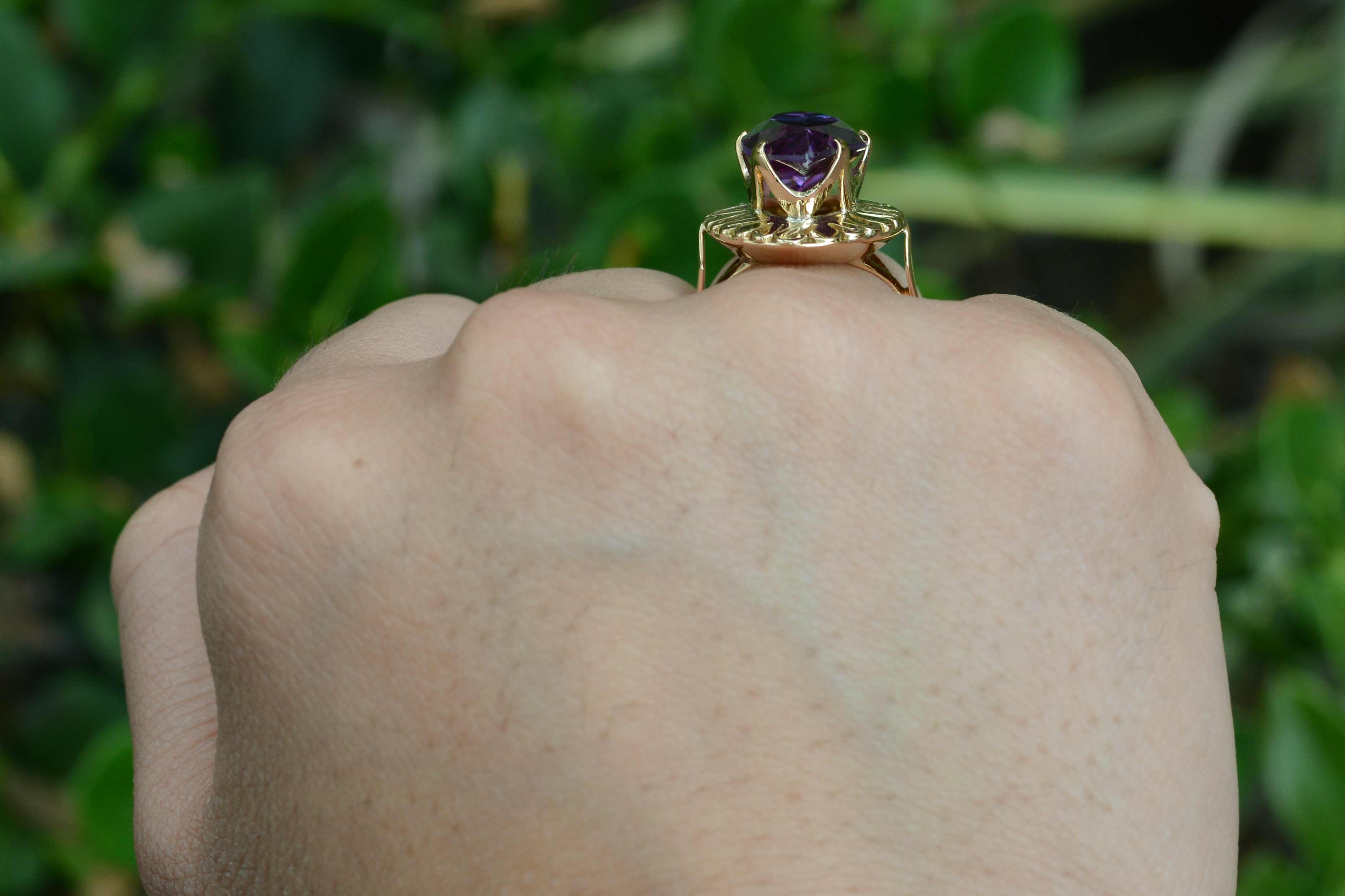 A 1940's, amethyst gold dome ring.