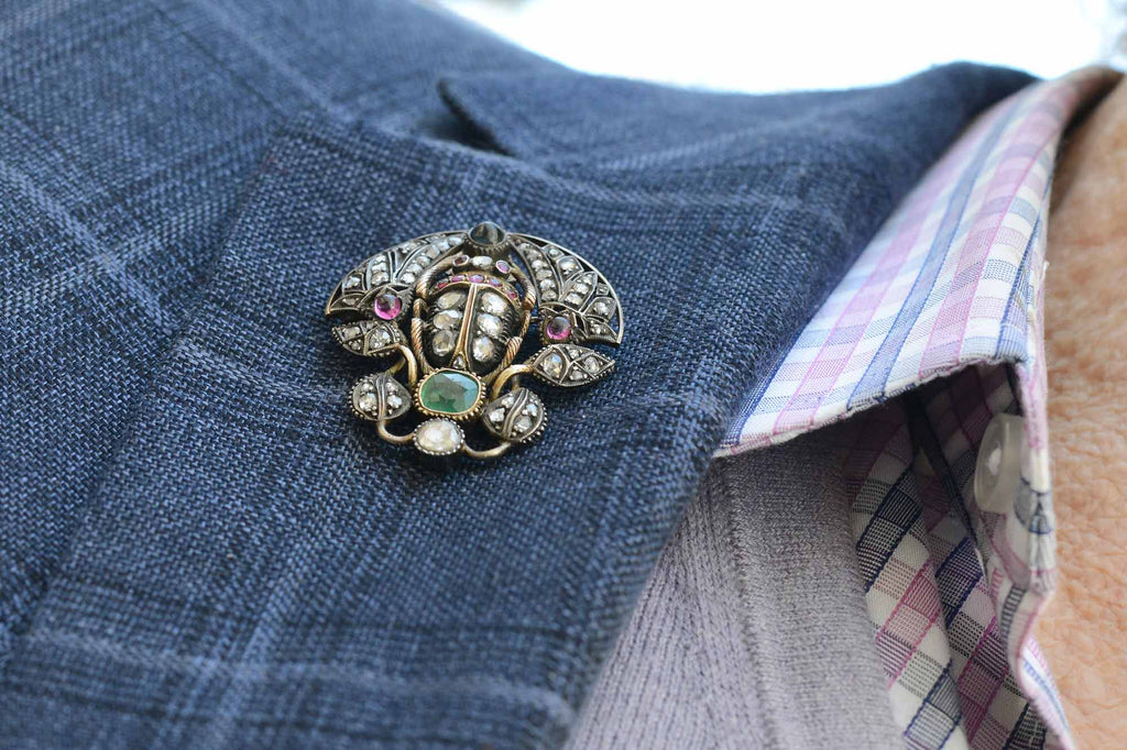A well made antique scarab beetle with rare gems and diamonds.
