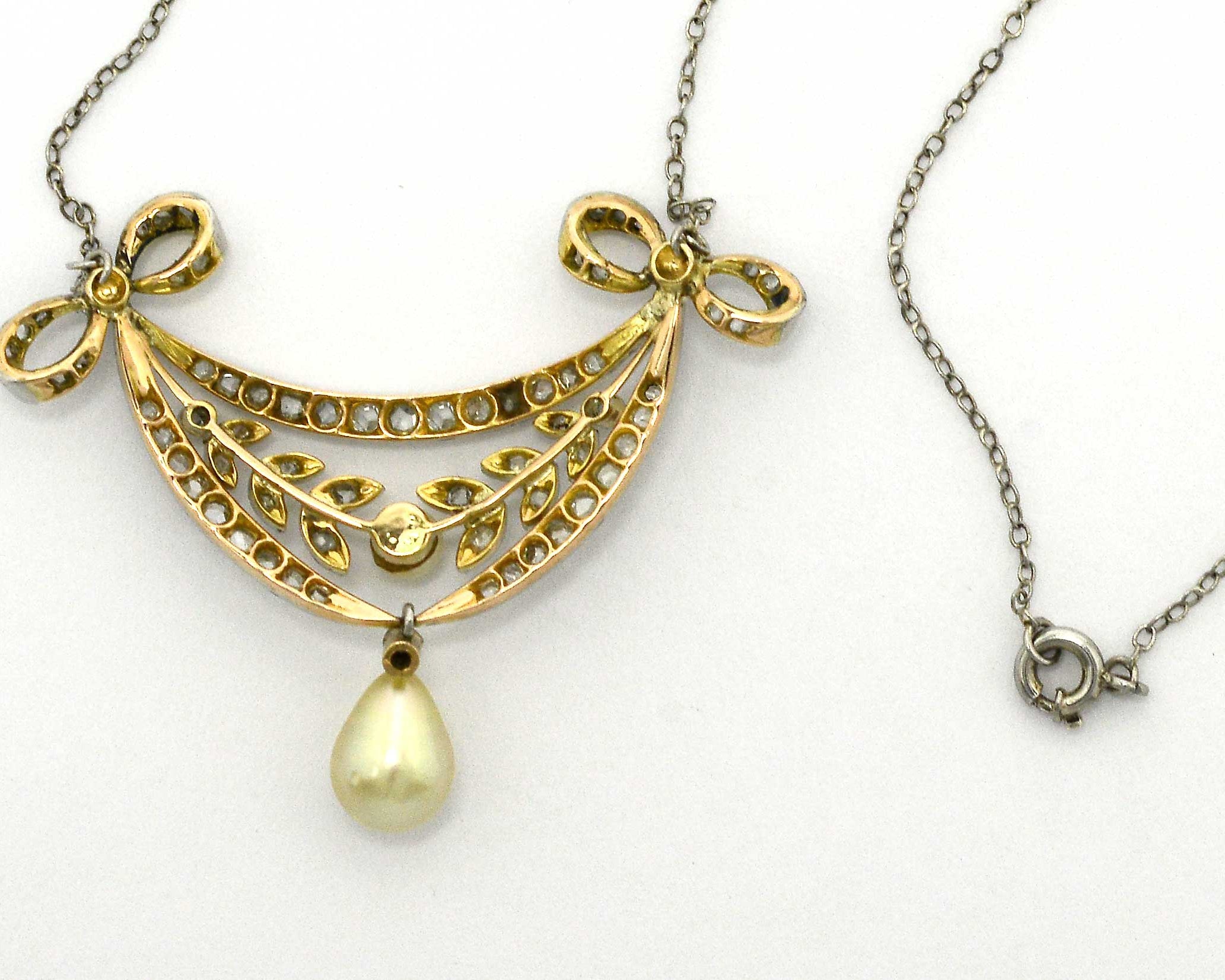 A gold and platinum natural pearl antique necklace.