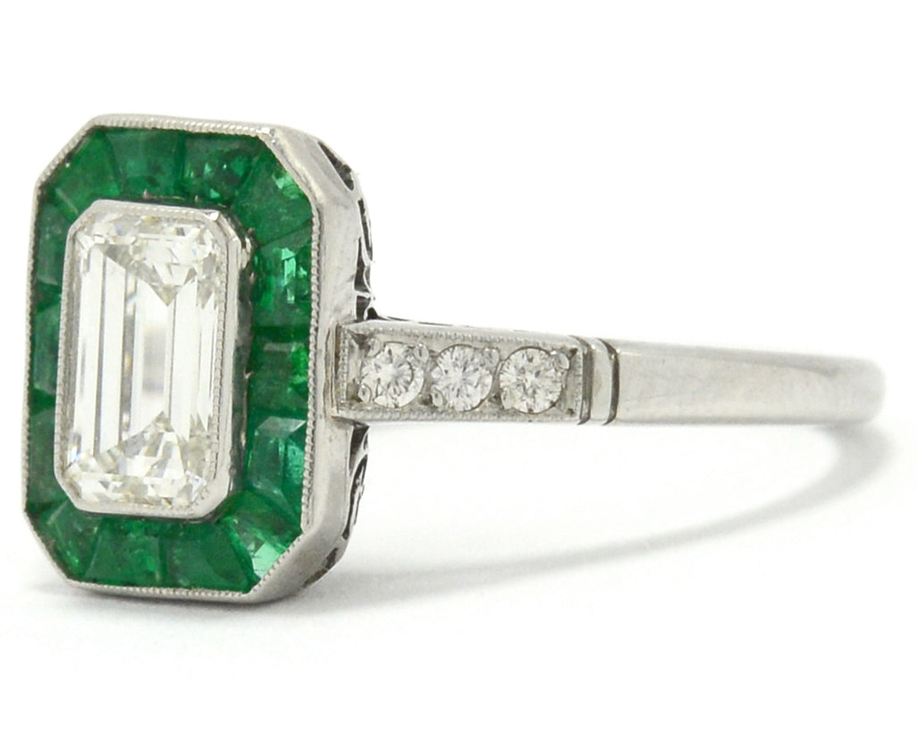 Old cut diamonds and a 1 carat emerald target engagement ring.