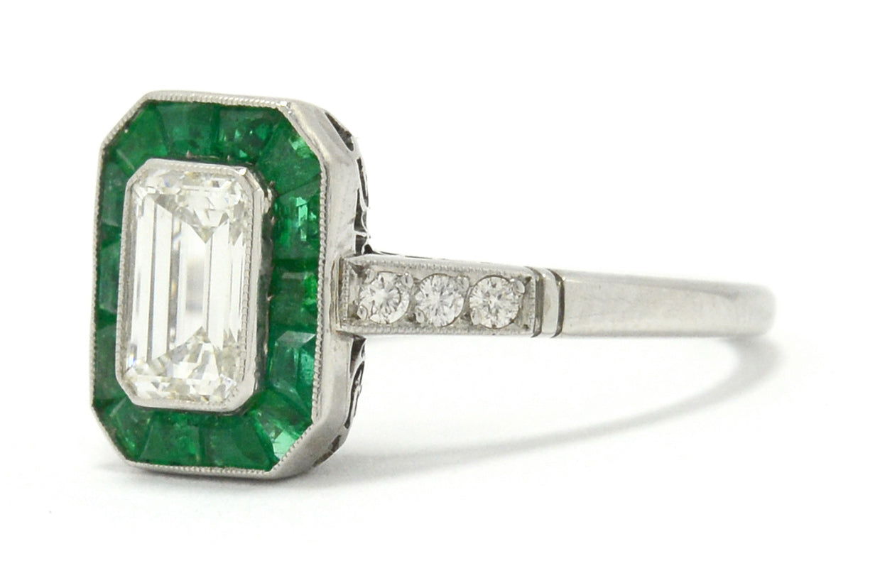 Old cut diamonds and a 1 carat emerald target engagement ring.