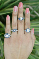 Art Deco diamond and blue sapphire, platinum engagement rings.