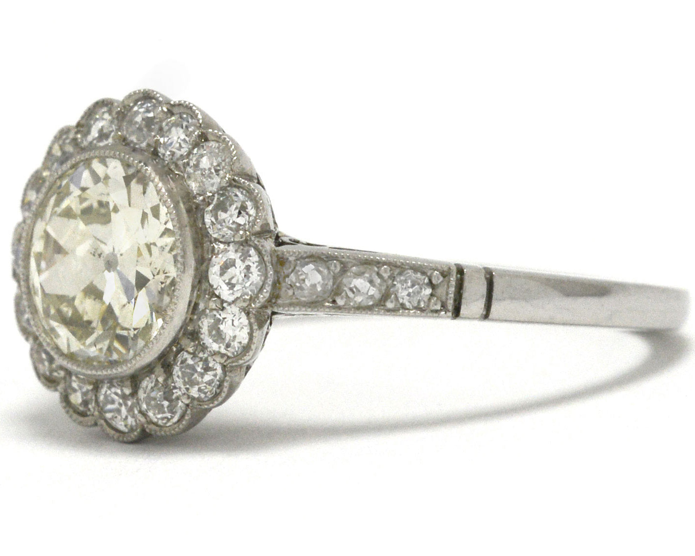 An over 1 carat old European diamond floral halo ring.