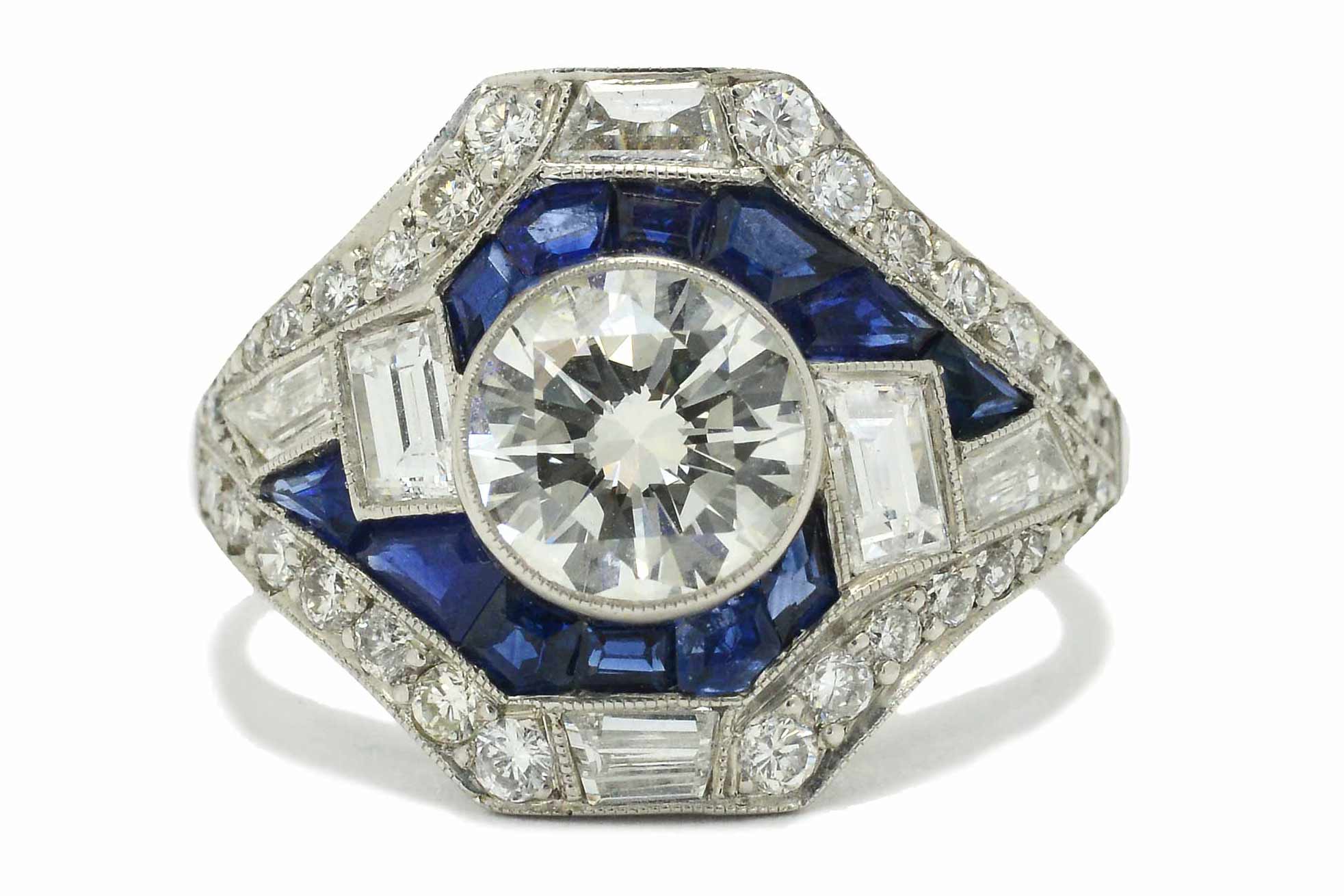 The Carlisle Hall is an astounding, asymmetrical Art Deco inspired diamond engagement ring.