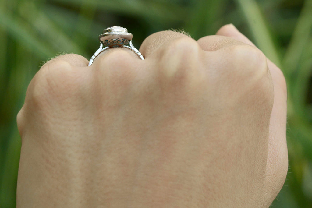 A 1.50 carat center diamond in a sapphire halo wedding ring.