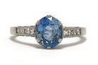 Art Deco inspired ceylon sapphire solitaire engagement ring with diamonds.