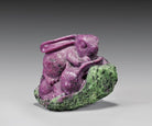 2 bunnies carved out of a rich apple green zoisite gemstone.