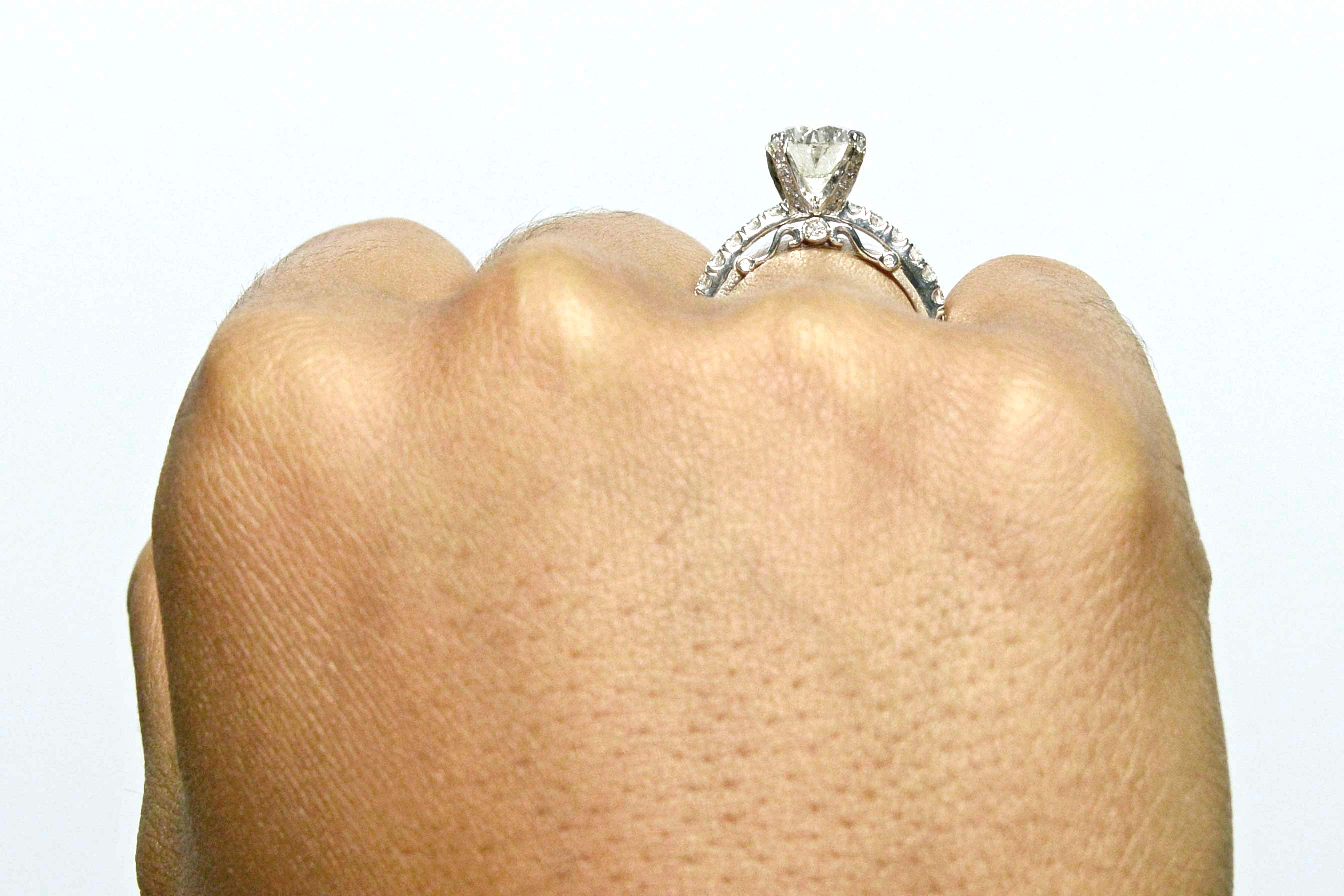 A tall set diamond solitaire ring.