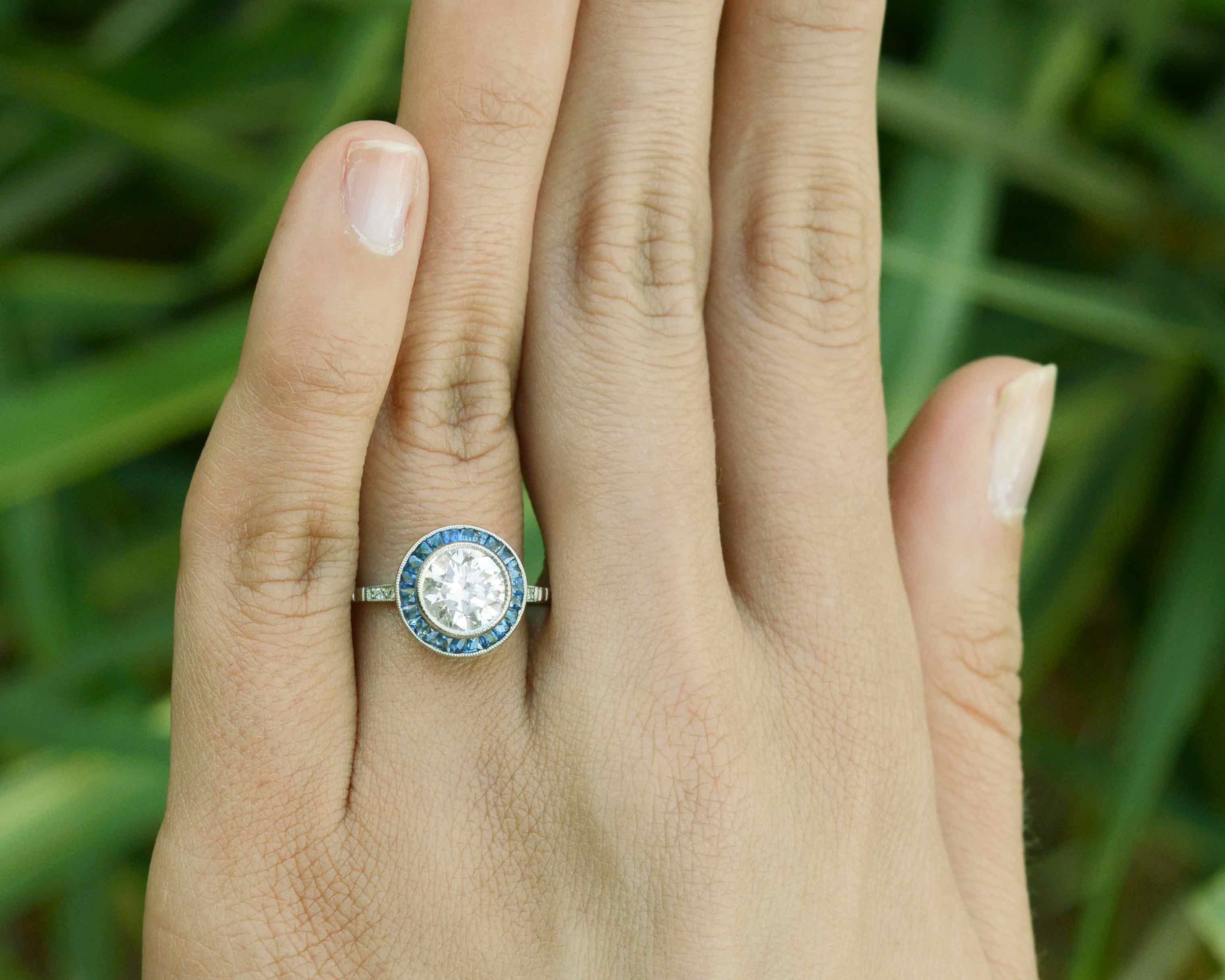 1.50 carat diamond target ring with blue sapphires.