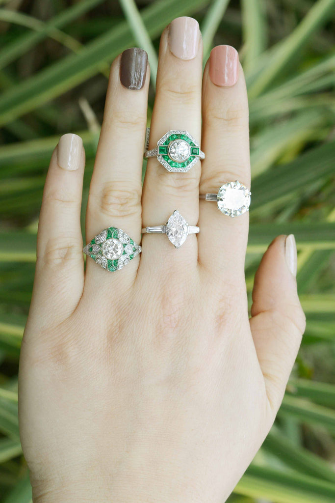 Diamonds and emeralds wedding rings.