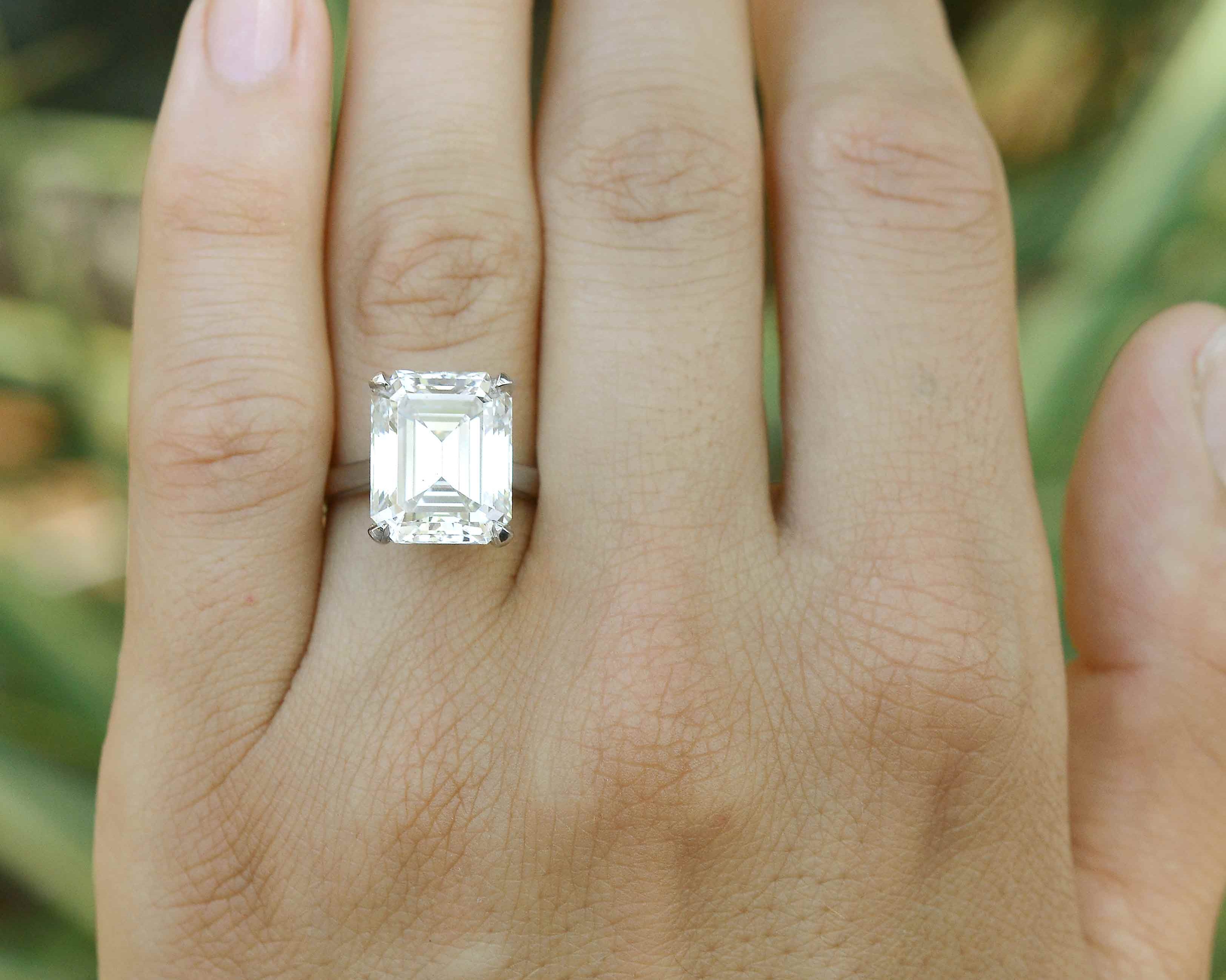 A giant emerald cut diamond set in a 4 prong soltaire setting.