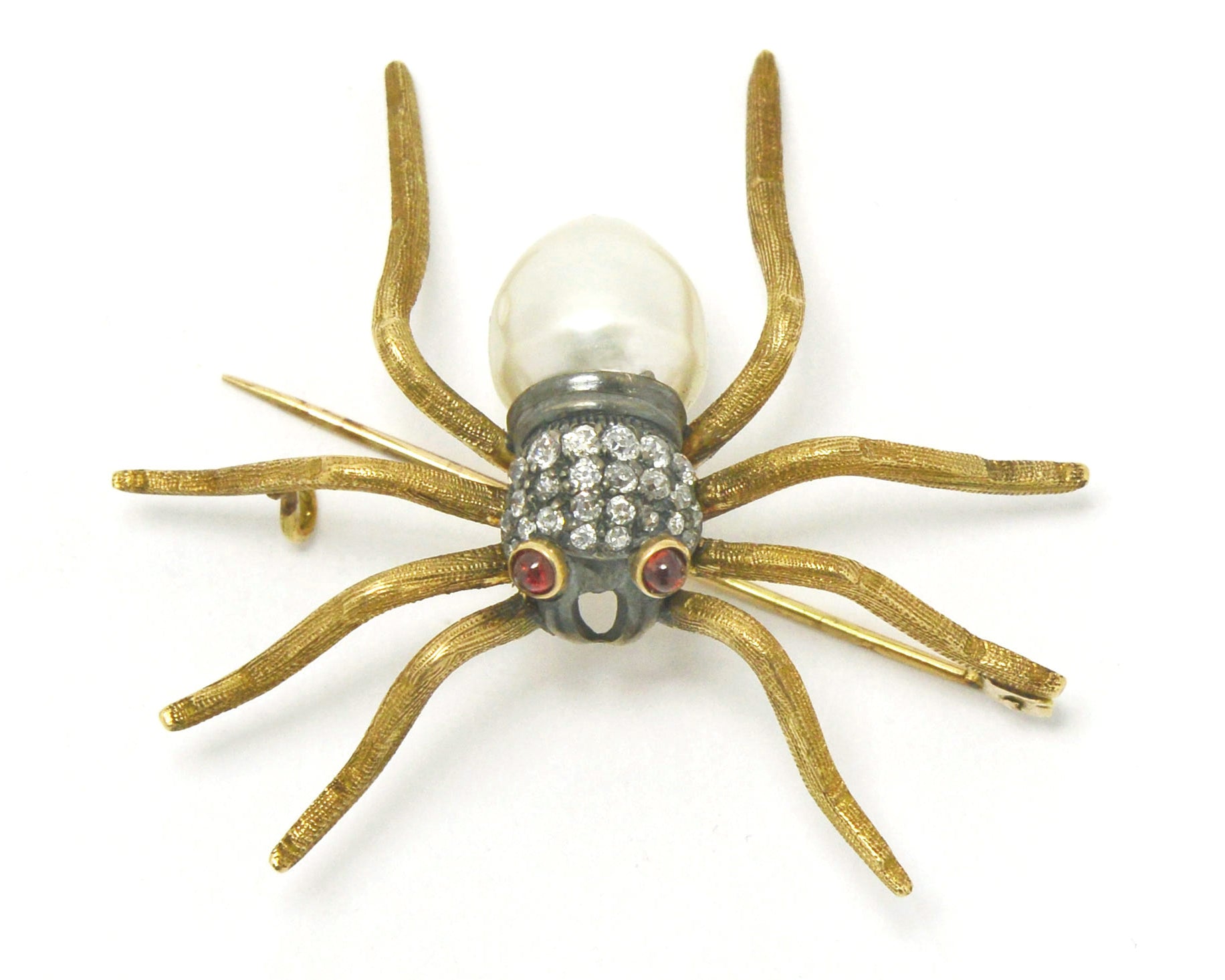 A late 1800s diamond and pearl spider brooch.