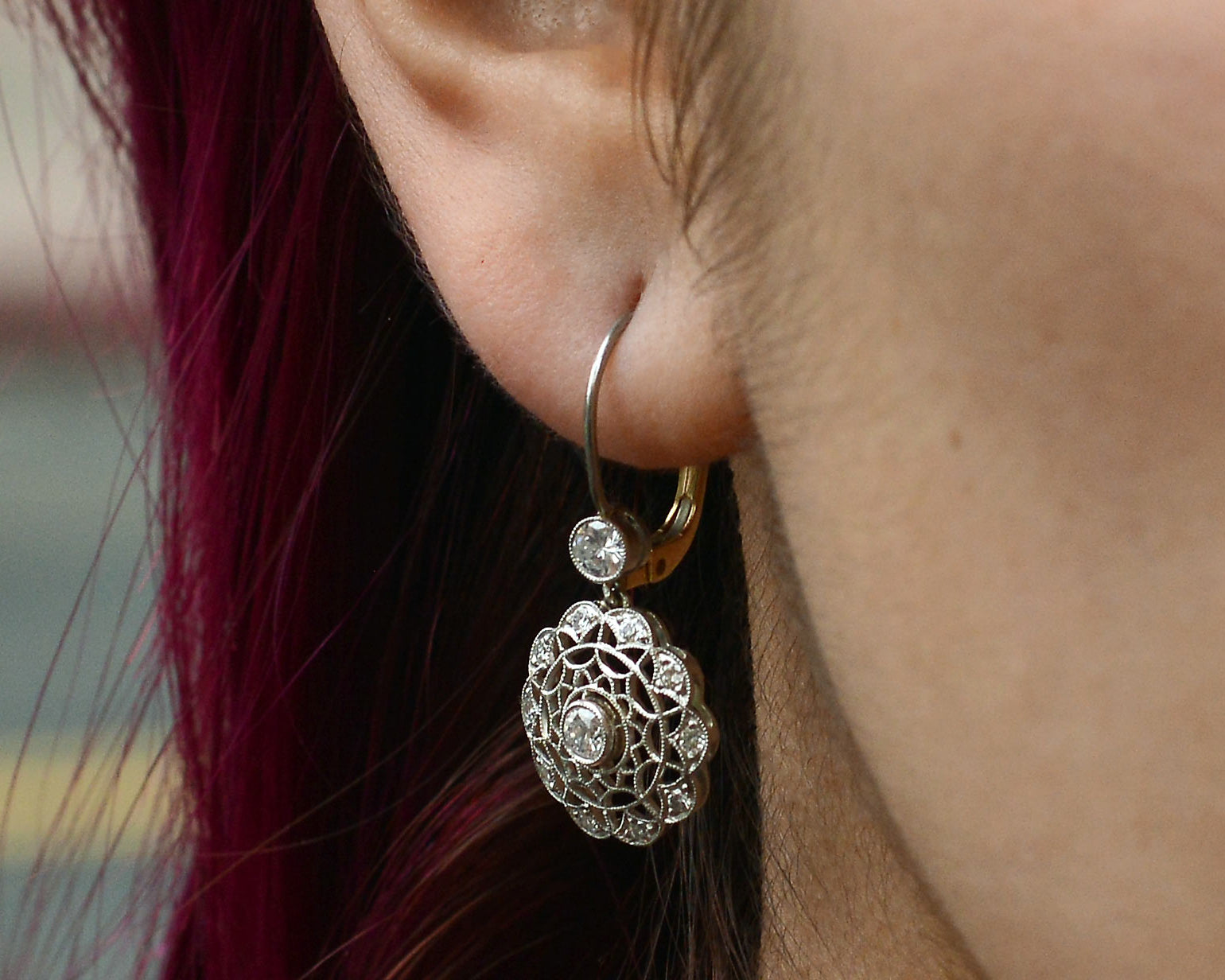 A webbed filigree design of earrings that resembles snowflakes.