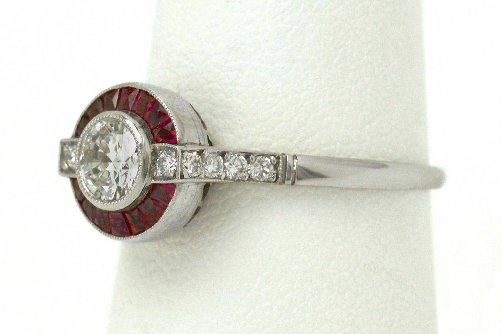 An old European brilliant diamond set in a ruby target Art Deco wedding ring design.