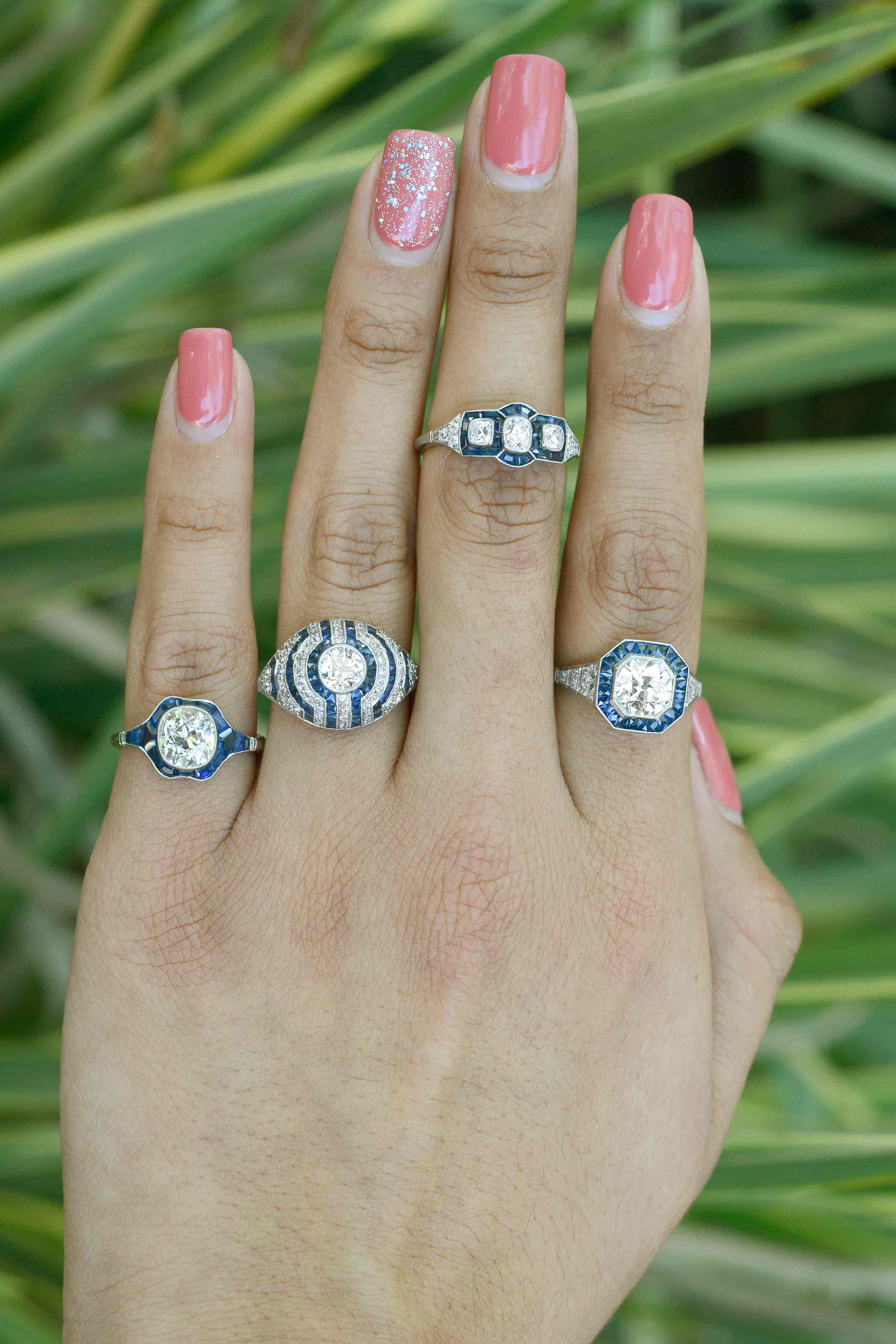Diamond and blue sapphire target design engagement rings.
