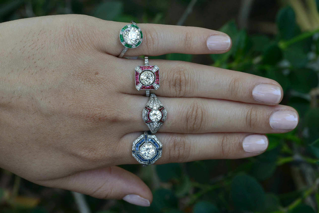 Art Deco style diamond and gem halo engagemnt rings.