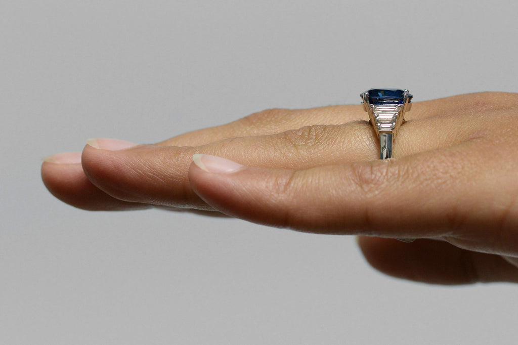 A vivid, royal blue sapphire, 18k white gold engagement ring.