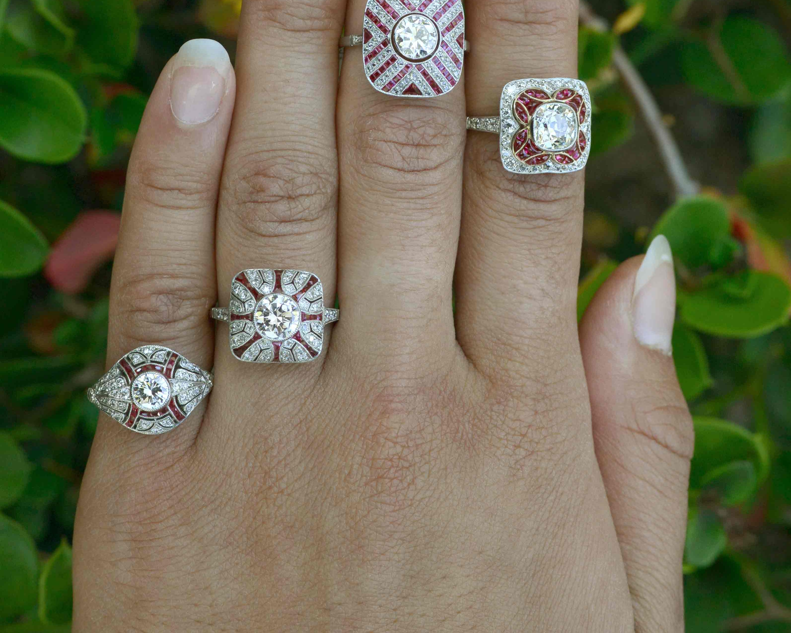 A collection of unique diamond and ruby halo wedding rings.