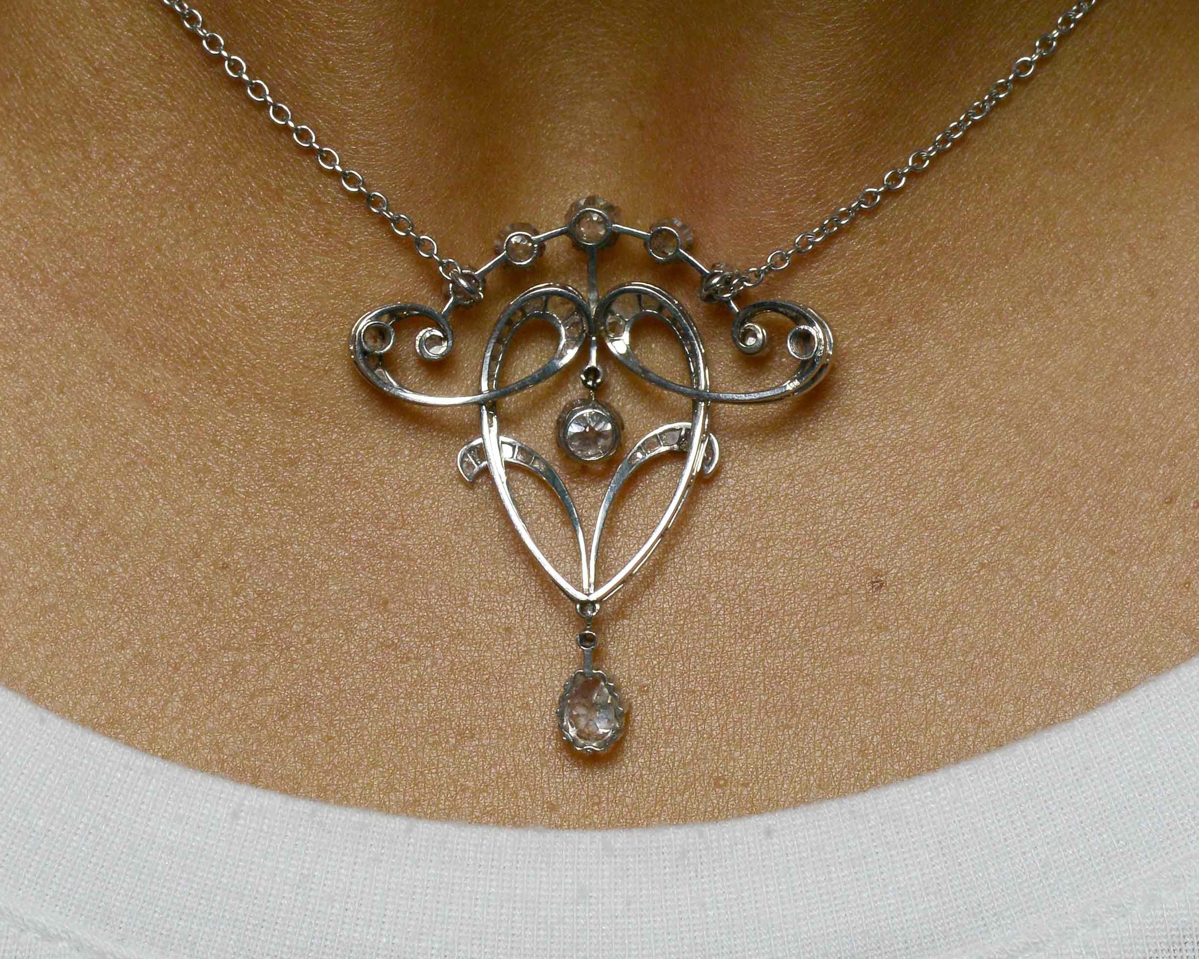 Old mine and rose cut diamond platinum pendant necklace.