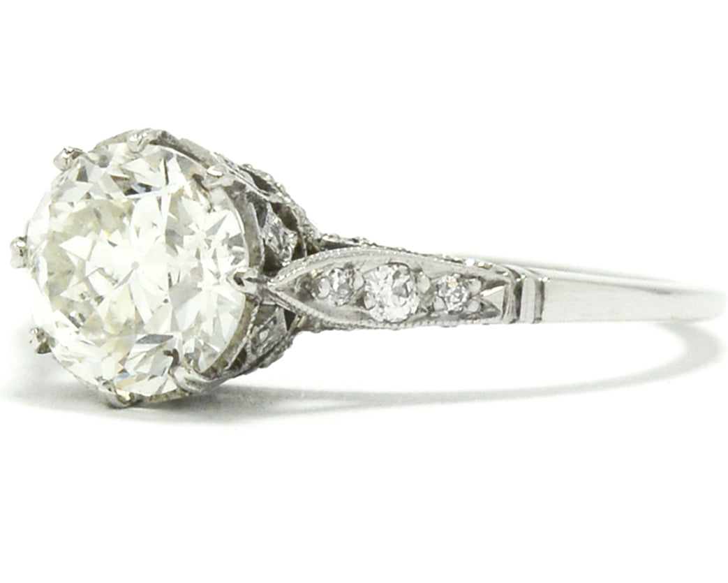 An 8 prong setting, platinum Edwardian style diamond engagement ring.