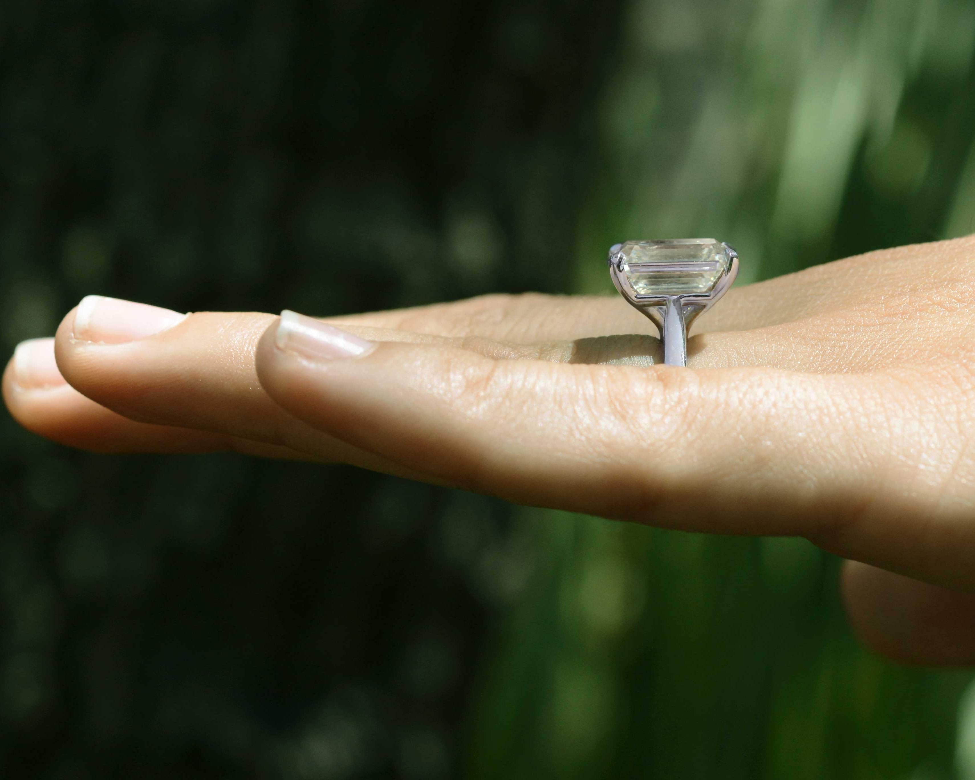A tall 8 carat diamond solitaire ring.