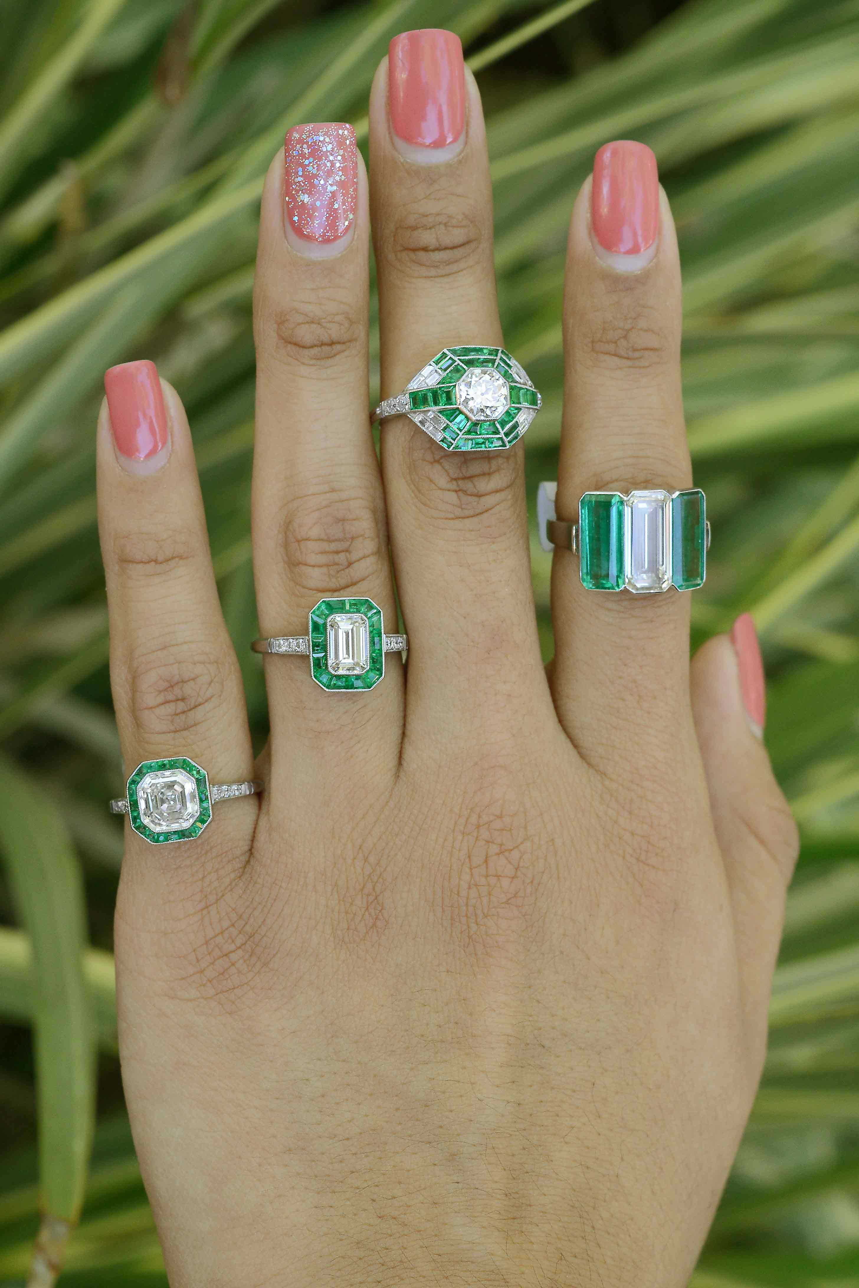 Some of our big diamond wedding rings with emerald gem accents.