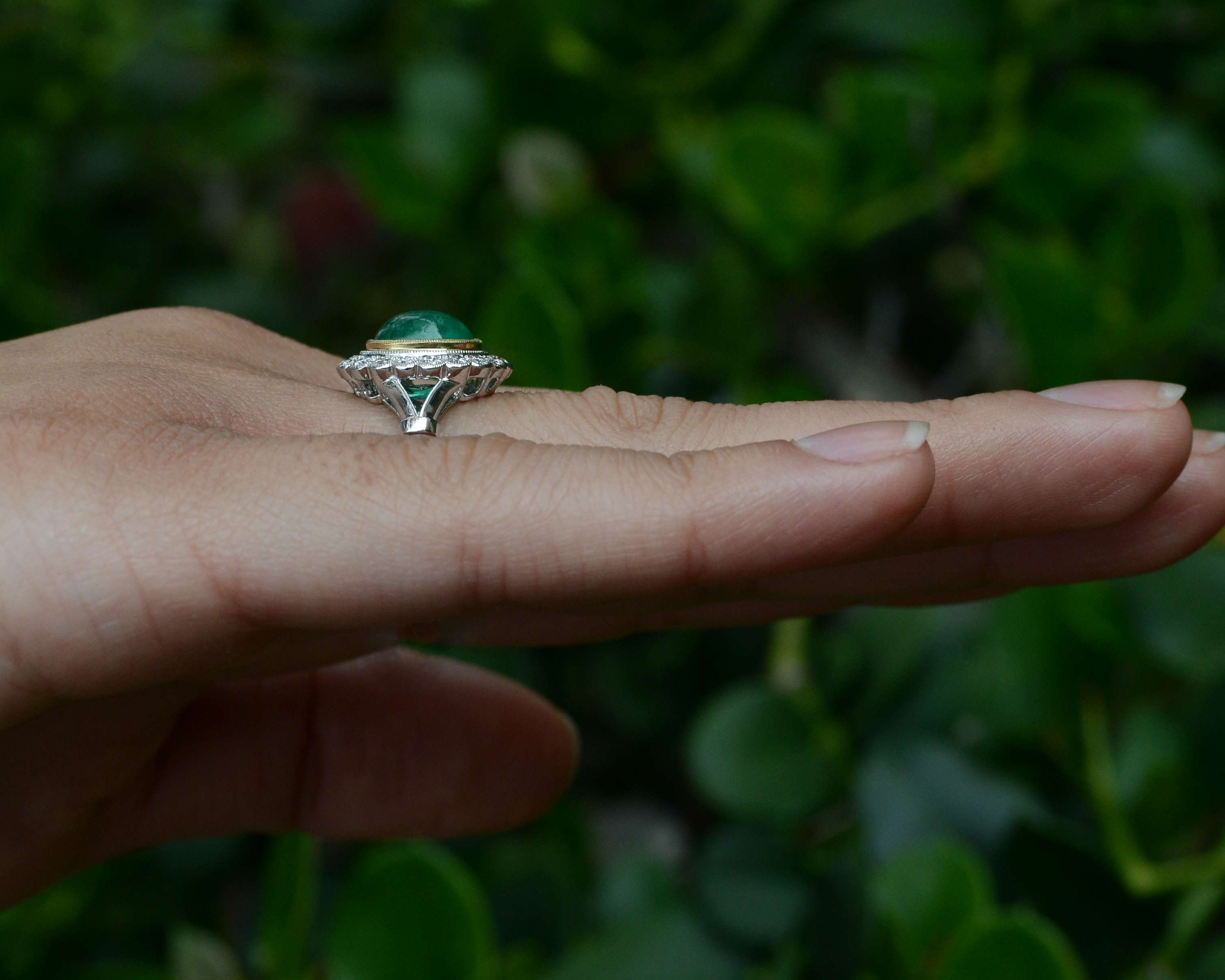 A 2 carat oval cabochon emerald statement ring.