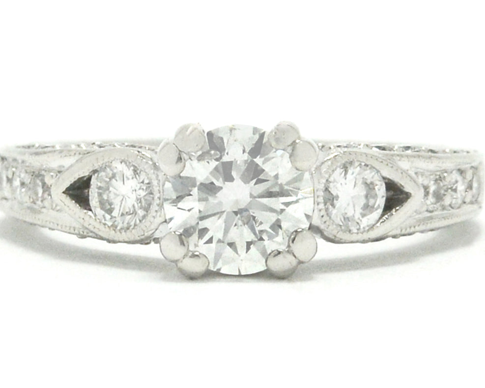 This modern round brilliant diamond solitaire engagement ring has an EGL report.