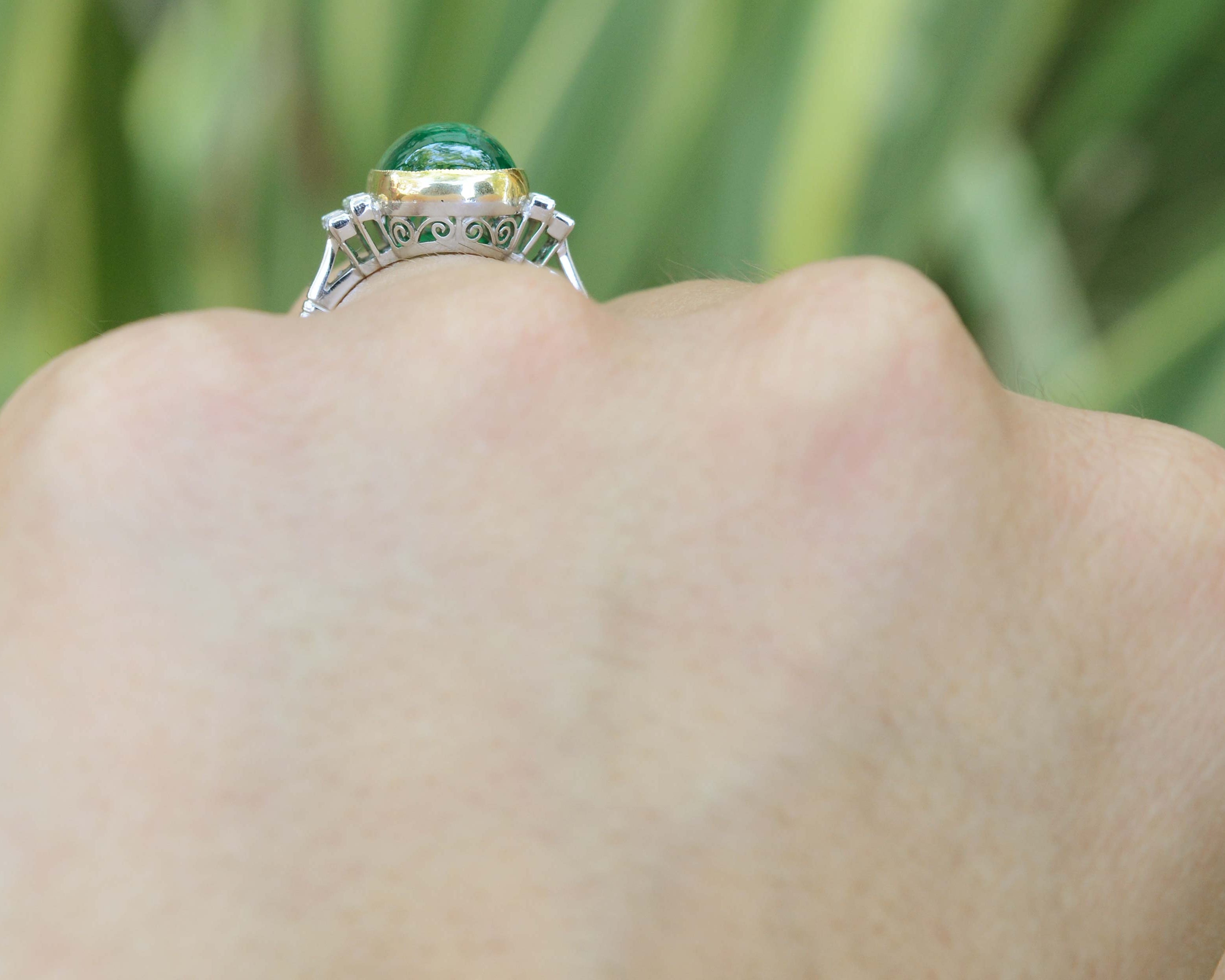 A large four carat cabochon dome emerald ring.