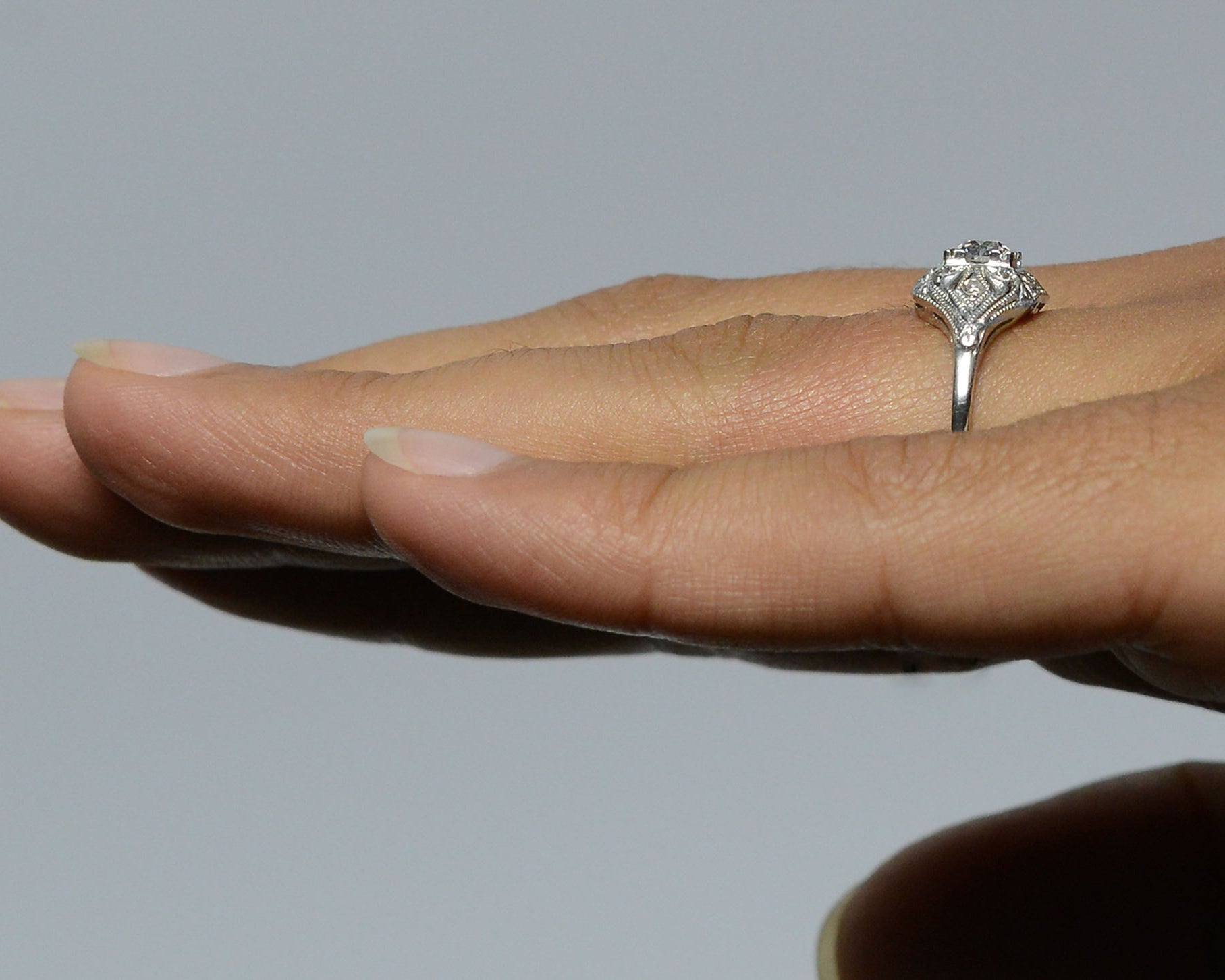 A fleur de lis pattern diamonds ring.