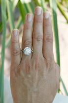 A flower shape diamonds halo engagement ring.