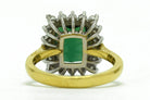 A large, 3 carat green tourmaline in a white gold basket ring setting.